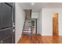 Inviting entryway featuring hardwood floors and a modern staircase at 4229 American Dr # F, Durham, NC 27705