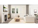 Comfortable living room with a modern fireplace, soft textures and abundant natural light from three large windows at 425 Cresting Wave Dr, Wake Forest, NC 27587