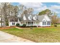 Charming two-story home with a inviting front porch and well-kept landscaping at 44 Loop Rd, Archer Lodge, NC 27527