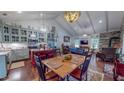 Open floor plan integrating a kitchen, dining area, and living space with beautiful wood flooring at 468 Loftis Loop Rd, Roxboro, NC 27574