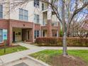 Charming multi-story condo with brick accents, private balconies, and well-maintained landscaping at 800 Moratuck Dr # 108, Raleigh, NC 27604