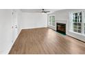 Bright living room with a fireplace and large windows offering lots of natural light at 100 Ampad Ct, Cary, NC 27513