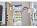 Inviting entryway features an open door, bright walls, and unique decor, creating a warm welcome to the home at 1120 N Roxboro St, Durham, NC 27701