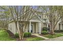 Charming home with a well-maintained lawn, inviting entrance, and quaint details at 11251 Lofty Heights Pl, Raleigh, NC 27614