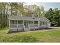 Charming single-story home with a welcoming front porch, shutters, and a well-maintained yard at 114 Marshay Meadow Rd, Youngsville, NC 27596