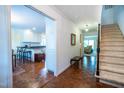 Entryway featuring hardwood floors, staircase, and view to the kitchen and living room at 114 Montrose Dr # 114, Durham, NC 27707