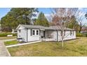 Well-kept home with a charming front porch and landscaped front yard at 116 Lakewood Dr, Wendell, NC 27591