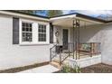 Inviting front porch with detailed iron railings, seating, and a welcoming entrance at 116 Lakewood Dr, Wendell, NC 27591