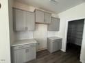 Bright kitchen featuring shaker cabinets, light countertops, modern backsplash, and stainless appliances at 118 Fairwinds Drive Dr, Lillington, NC 27546