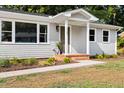 Detailed view of the home's entrance, highlighting the landscaping and architectural details at 122 W Union St, Hillsborough, NC 27278