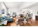 Bright and airy living room featuring hardwood floors and an open floor plan at 122 W Union St, Hillsborough, NC 27278