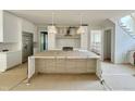 Modern kitchen featuring an island, stainless steel appliances, and a pantry at 1309 Sanctuary Pond Dr, Raleigh, NC 27603