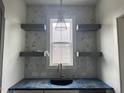 Stylish bar area featuring floating shelves, elegant backsplash, and a modern pendant light at 20 Serenity Woods Trl, Franklinton, NC 27525