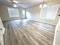 Bright living room with light-toned flooring and plenty of natural light from large windows at 202 Allen St # A/B, Creedmoor, NC 27522