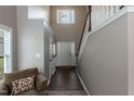 Spacious foyer featuring a staircase, hardwood floors, and natural light at 206 Newberry Ln, Durham, NC 27703