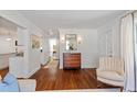Bright entryway featuring hardwood floors, a classic wood dresser, and elegant decor at 2714 Gordon St, Raleigh, NC 27608
