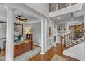 Bright foyer with hardwood floors, a grand staircase, and classic architectural details at 317 Briarfield Dr, Apex, NC 27502