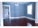 Bright dining room featuring hardwood floors and ample natural light with entry to kitchen at 428 Matthews St, Rocky Mount, NC 27801