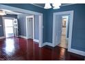Comfortable living room with beautiful hardwood floors and multiple doorways, offering easy access to other rooms at 428 Matthews St, Rocky Mount, NC 27801