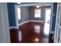 Inviting living room featuring newly refinished hardwood floors, trim and neutral wall paint color at 428 Matthews St, Rocky Mount, NC 27801
