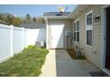 Private backyard space with vinyl fencing and well maintained patio, perfect for outdoor entertaining and relaxation at 536 Dearing Dr, Haw River, NC 27258