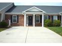 Inviting brick home featuring a spacious driveway and well-maintained lawn, offering a comfortable suburban lifestyle at 536 Dearing Dr, Haw River, NC 27258