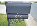 Close-up of a black mailbox with the house number '536' displayed in gold lettering, adding a touch of elegance at 536 Dearing Dr, Haw River, NC 27258
