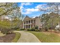 Attractive two-story home with a brick facade, complemented by a winding driveway at 5521 Erinvale Ct, Holly Springs, NC 27540
