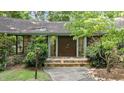 Close-up view of the stone entrance with stone steps to the double front door at 8805 Leesville Rd, Raleigh, NC 27613