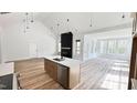 Modern kitchen with quartz counters, stainless appliances, and large island at 120 Sequoia Dr, Louisburg, NC 27549