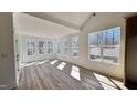 Bright sunroom with large windows and wood floors at 120 Sequoia Dr, Louisburg, NC 27549