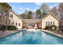 Beautiful swimming pool with an iron fence surrounded by the home offering a private backyard oasis at 120 Teasel Ct, Clayton, NC 27527