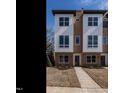Contemporary townhome with a sleek exterior design, manicured lawn, and inviting pathway to the entrance at 1317 Garner Rd # 101, Raleigh, NC 27610