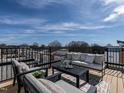 Relaxing rooftop deck offers an outdoor oasis with comfortable seating and scenic neighborhood views at 1317 Garner Rd # 101, Raleigh, NC 27610
