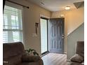 Welcoming entryway with an open door and hardwood floors at 194 Cornfield Ln, Benson, NC 27504