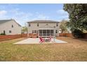 Spacious backyard with a fire pit, patio, and deck with access to the home at 2001 Lilly Brook St, Fuquay Varina, NC 27526