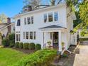 Charming two-story home with a well-manicured lawn and shrubbery at 2108 Myrtle Ave, Raleigh, NC 27608