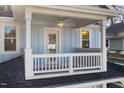 Close-up view of the balcony featuring a ceiling fan and stylish railing at 306 Cecil St, Durham, NC 27707