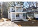 Charming two-story home with a welcoming front porch and a classic architectural design at 306 Cecil St, Durham, NC 27707