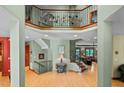 Grand foyer with high ceilings, decorative ironwork, and hardwood floors, leading to the living areas at 6016 Glenthorne Dr, Raleigh, NC 27613