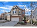 A well-maintained townhome featuring a two-car garage, siding exterior and a concrete driveway at 640 Newlyn Dr, Raleigh, NC 27606