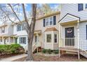 Townhouse complex featuring vinyl siding, shuttered windows, and front entrances at 6734 Chauncey Dr, Raleigh, NC 27615