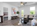 Cozy living room with hardwood floors, neutral tones, and natural light at 88 Baldwin St, Lillington, NC 27546