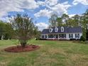 Charming home with well-maintained lawn, attractive landscaping, and a classic white exterior at 117 Linwood Ln, Clayton, NC 27527