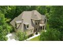 Aerial view of the home showcasing the roof, landscaping, and three-car garage at 1217 Mauldin Rd, Wake Forest, NC 27587
