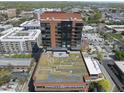 View of the luxury high-rise featuring balconies, rooftop garden, and city views at 122 N Harrington St # 775, Raleigh, NC 27603