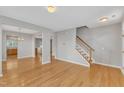 Spacious living room featuring hardwood floors, stairs, and neutral paint at 125 Hidden Springs Dr, Durham, NC 27703