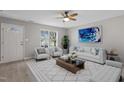 Bright living room features modern decor, hardwood floors, and a large window at 1620 Briarmont Ct, Raleigh, NC 27610