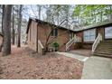 Brick home with neat landscaping features stairs, windows, and security system at 200 W Woodcroft Pkwy # 37A, Durham, NC 27713