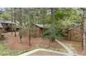 Residential home with brick facade surrounded by trees and walkway at 200 W Woodcroft Pkwy # 37A, Durham, NC 27713